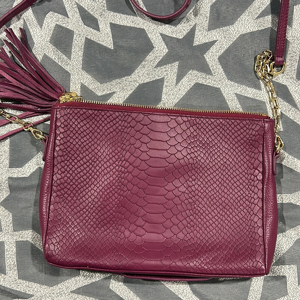 Maroon “snake” skin messenger bag. Gigi